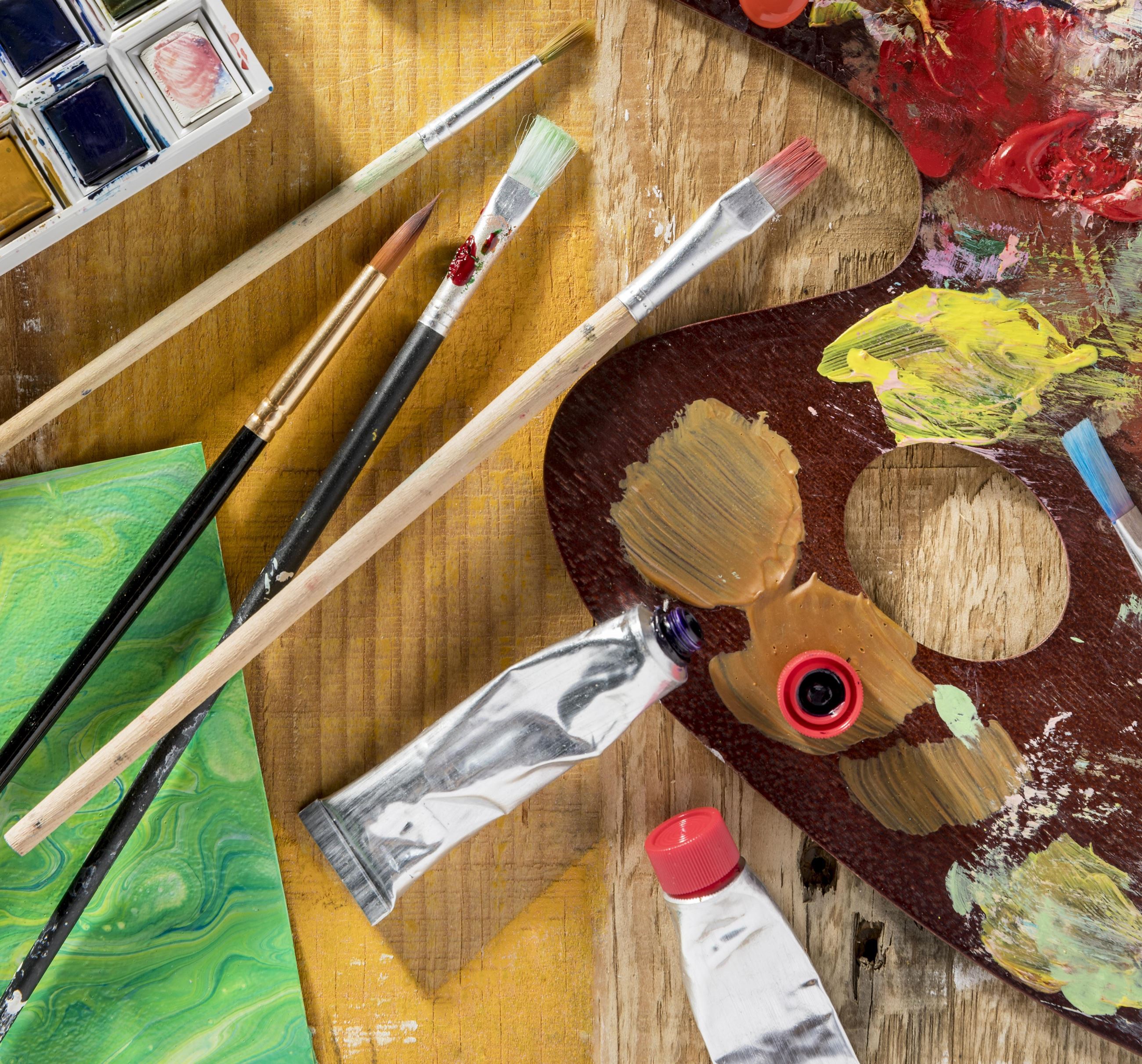 top-view-paint-brushes-with-palette-paint