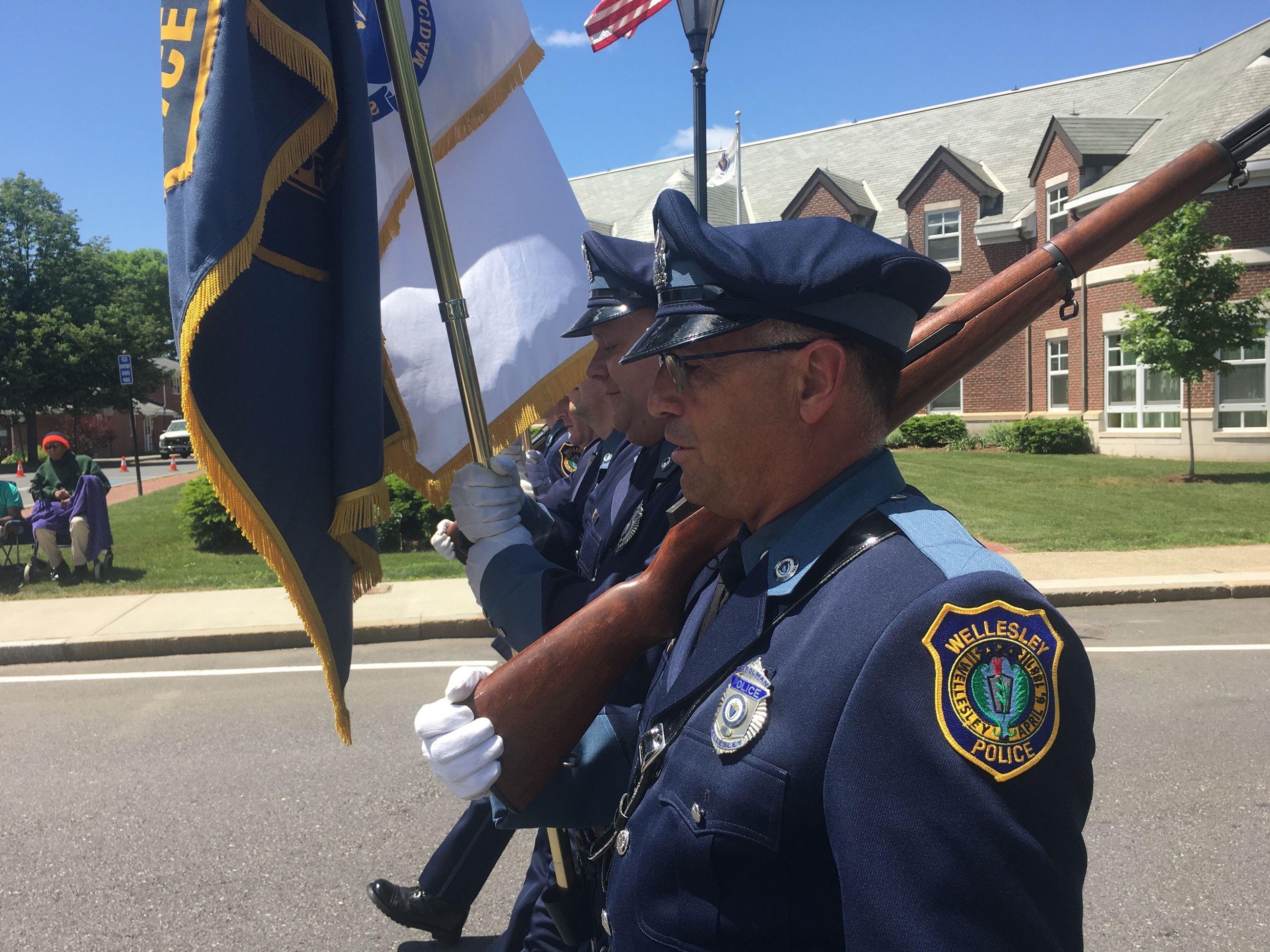 Officer Jim Amalfi marches past the police station during the annual parade.